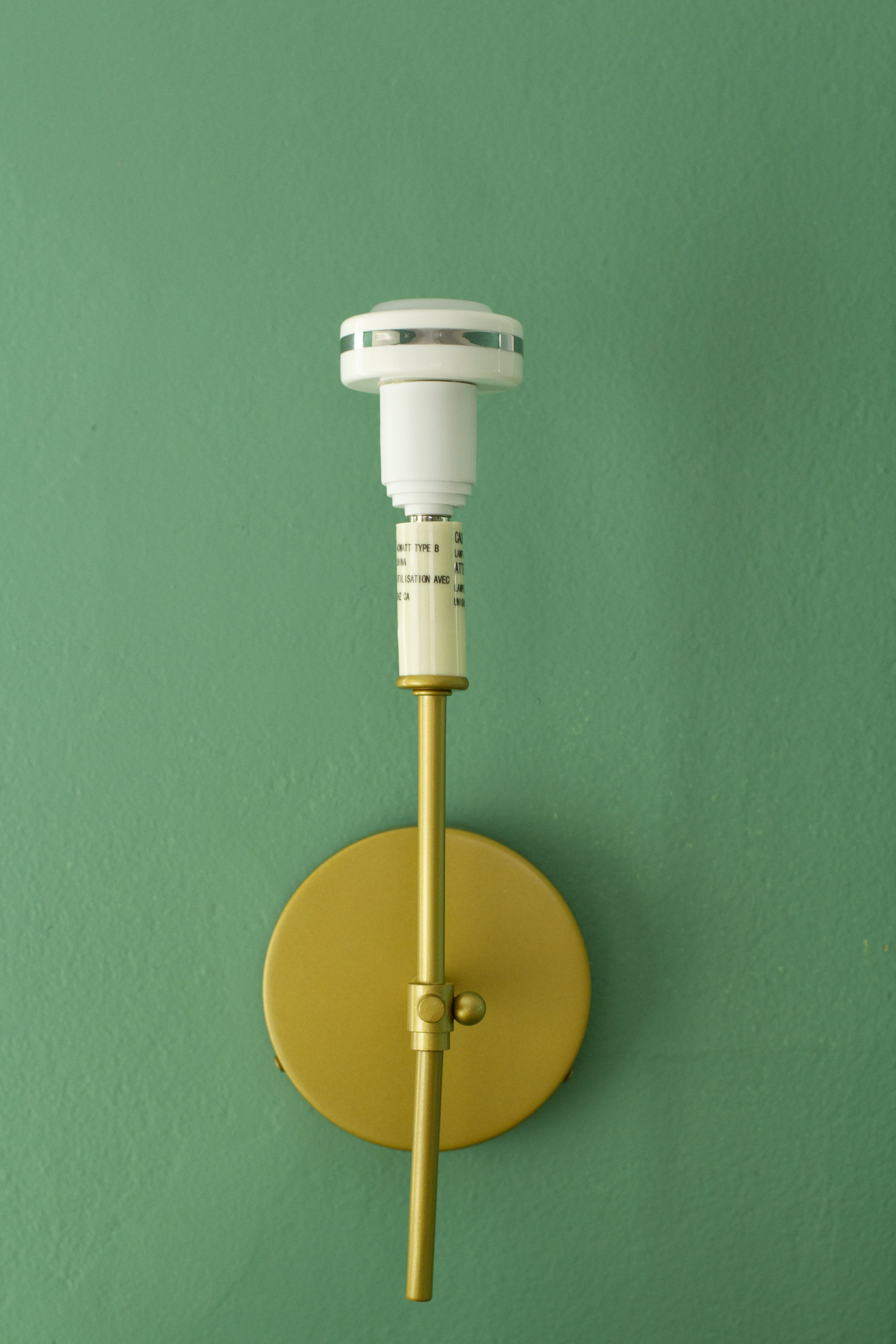 Puck shop light sconce